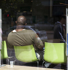 Image showing client waiting in an electronic queue in the office