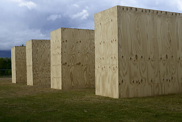 Image showing wooden parallelepipeds on a green lawn