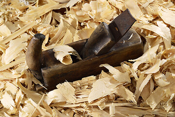 Image showing a lot of fresh wood shavings and vintage planer