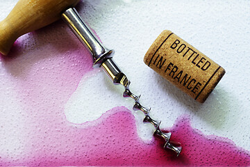 Image showing vintage old corkscrew and wine cork 