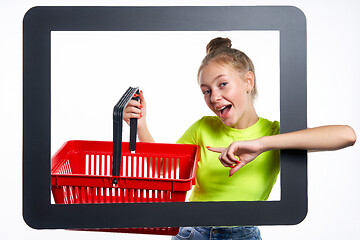 Image showing Online shopping concept. Trendy teen girl with empty shopping basket