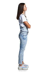 Image showing Full length profile portrait of a teen girl standing looking in front