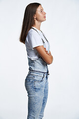 Image showing Profile portrait of a teen girl standing looking in front