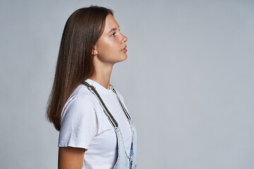 Image showing Closeup profile portrait of a teen gir looking forward