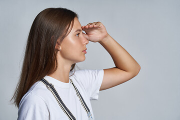 Image showing Closeup profile portrait of a teen gir looking forward