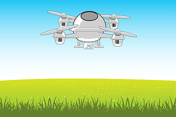 Image showing Flying machine quadcopter in sky on green glade