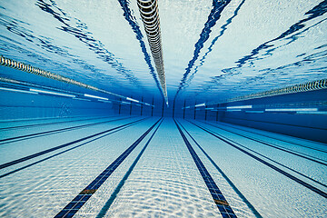 Image showing Olympic Swimming pool under water background.