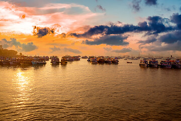 Image showing Boats on Mumbai water at dawn. Colaba region of Mumbai, Maharash