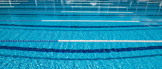 Image showing Olympic Swimming pool background on a bright Sunny day