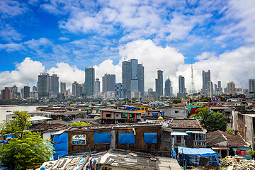 Image showing Views of slums on the shores of mumbai, India against the backdr