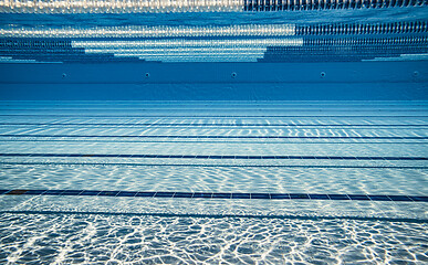 Image showing Olympic Swimming pool under water background.