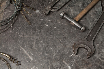 Image showing Old tools set on a vintage metallic background with space for text