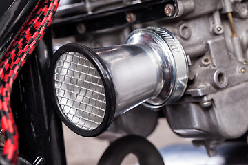 Image showing Custom bobber motorbike in an workshop garage.