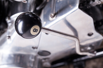 Image showing Custom bobber motorbike in an workshop garage.