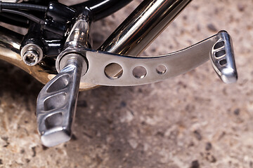 Image showing Custom bobber motorbike in an workshop garage.