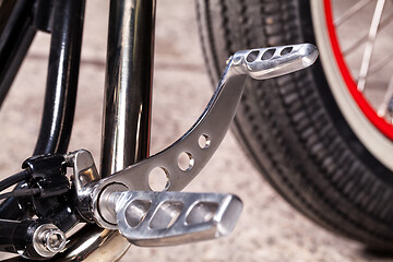 Image showing Custom bobber motorbike in an workshop garage.