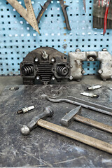 Image showing Motorist\'s workplace. Old tools set on metallic table with tools and motorparts