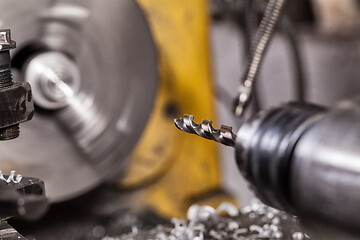 Image showing Old yellow lathe drilling machine with a lot of handles.