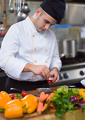 Image showing Chef hands preparing marinated Salmon fish