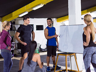 Image showing athletes getting instructions from trainer