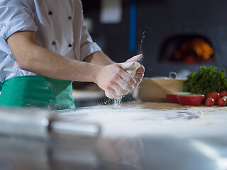 Image showing chef hands preparing dough for pizza