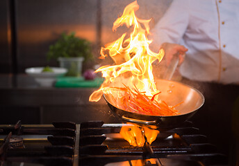 Image showing Chef doing flambe on food