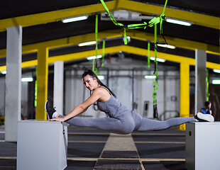 Image showing woman working out gymnastic exercise on fit boxes