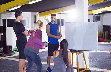 Image showing athletes getting instructions from trainer