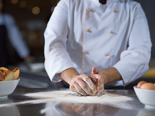 Image showing chef hands preparing dough for pizza