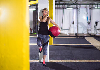 Image showing portrait of woman with red crossfitness ball