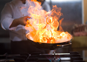 Image showing Chef doing flambe on food