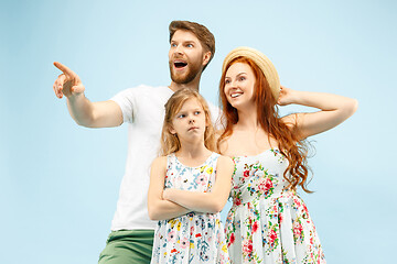 Image showing Happy parent with daughter at studio isolated on blue background