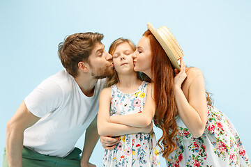 Image showing Happy parent with daughter at studio isolated on blue background