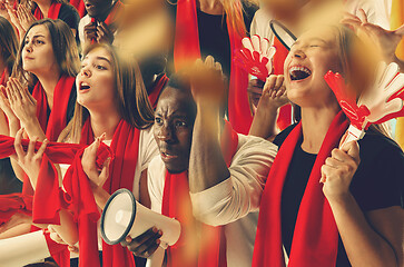 Image showing Group of happy fans are cheering for their team victory.