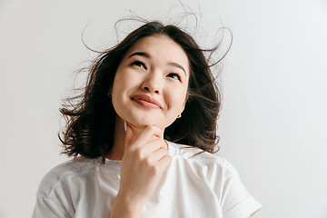 Image showing Young serious thoughtful business woman. Doubt concept.