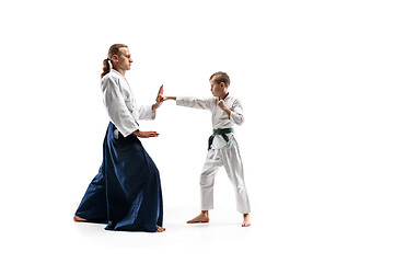 Image showing Man and teen boy fighting at aikido training in martial arts school