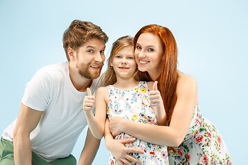 Image showing Happy parent with daughter at studio isolated on blue background