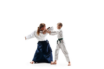 Image showing Man and teen boy fighting at aikido training in martial arts school