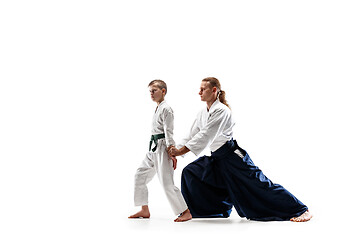 Image showing Man and teen boy fighting at aikido training in martial arts school