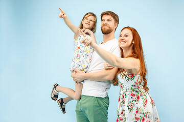 Image showing Happy parent with daughter at studio isolated on blue background