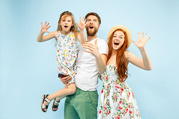 Image showing Happy parent with daughter at studio isolated on blue background