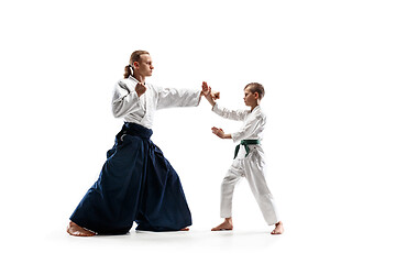 Image showing Man and teen boy fighting at aikido training in martial arts school