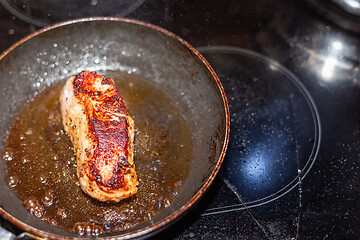 Image showing Finished veal steak in a pan