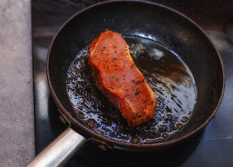 Image showing Raw veal steak in a pan