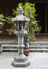 Image showing Stone buddhist lamp in japanese garden