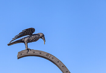 Image showing Raven carrying a gold ring near Royal Palace of Budapest