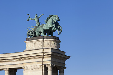 Image showing Statue of a man on a chariot, symbol of war, on a colonnade in Heroes Square, Budapest