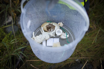 Image showing Picking up Plastic Waste