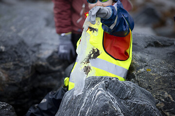 Image showing Picking up Plastic Waste