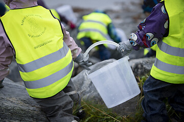 Image showing Picking up Plastic Waste